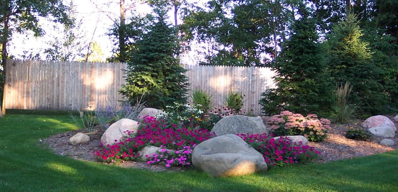 Colorful flower garden with natural boulders