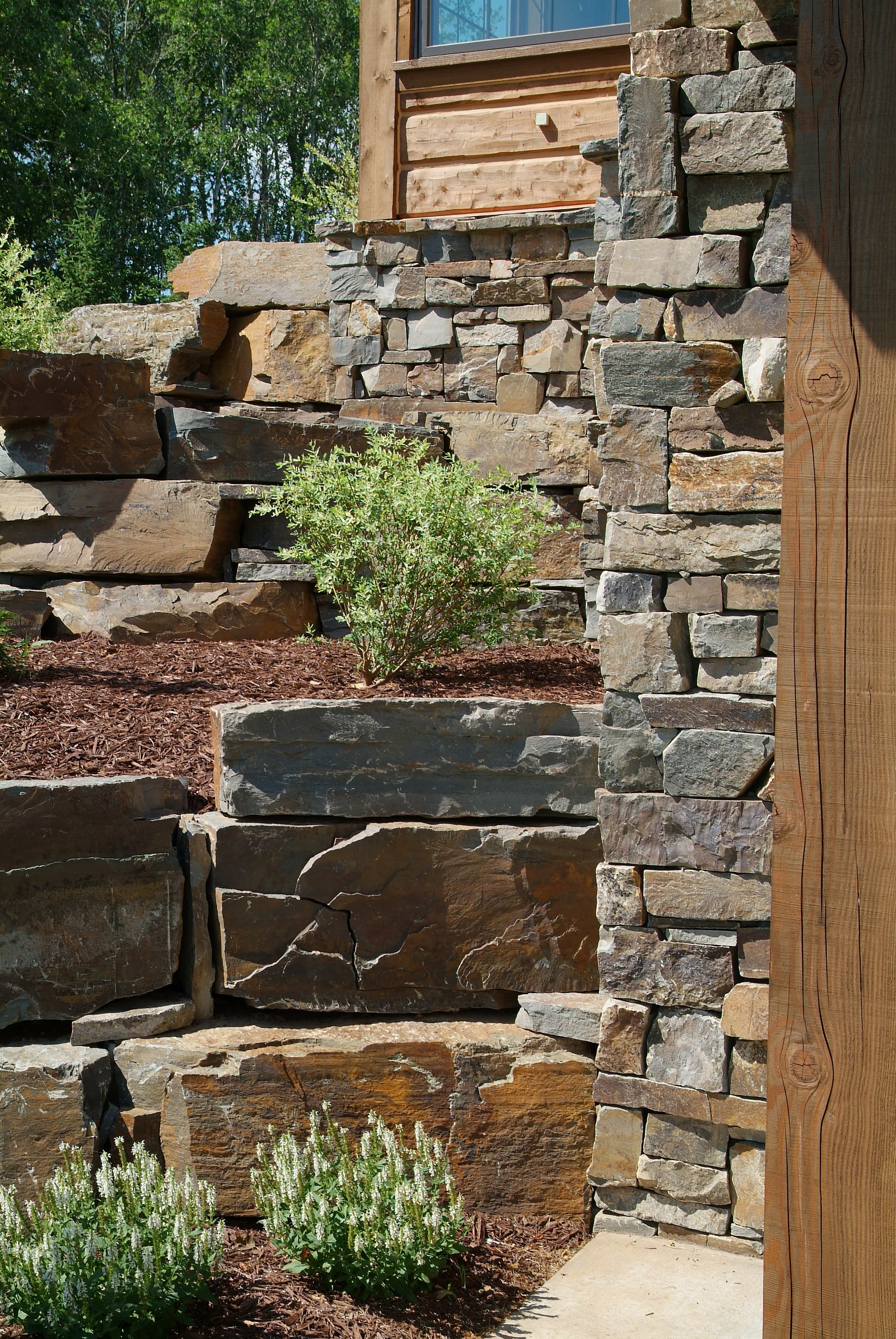 Stacked stone retaining wall